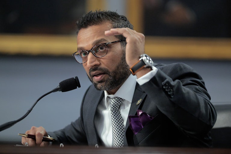 FBI Director Kash Patel testifies in Congress and makes a hand gesture as if to say this is the limit.