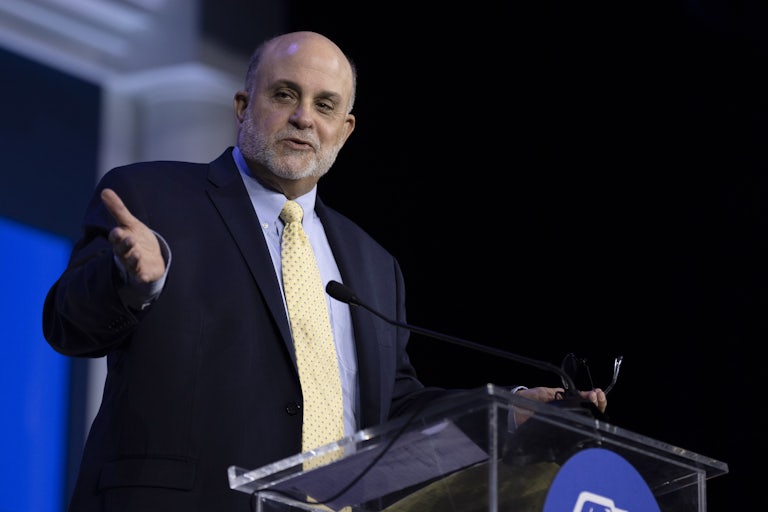Fox News host Mark Levin gestures while speaking at a podium