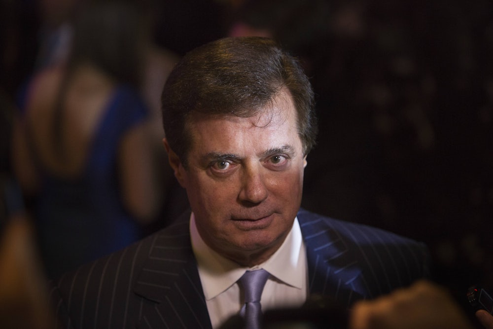 Paul Manafort speaks with the press during an election night event in 2016.