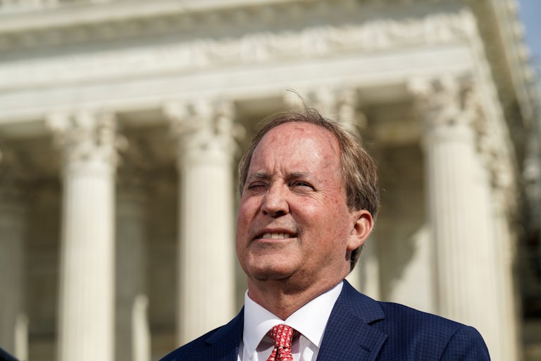 Texas Attorney General Ken Paxton smiles outside the Supreme Court