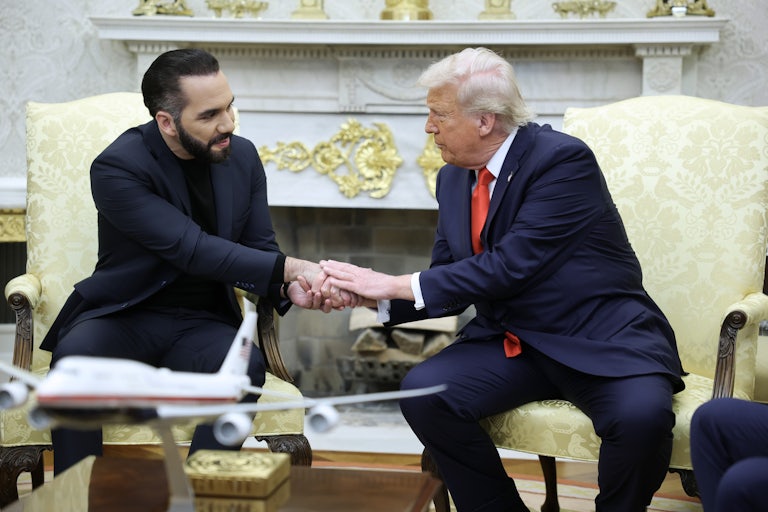 Donald Trump shakes hands with Salvadoran President Nayib Bukele as the two sit in the Oval Office of the White House.