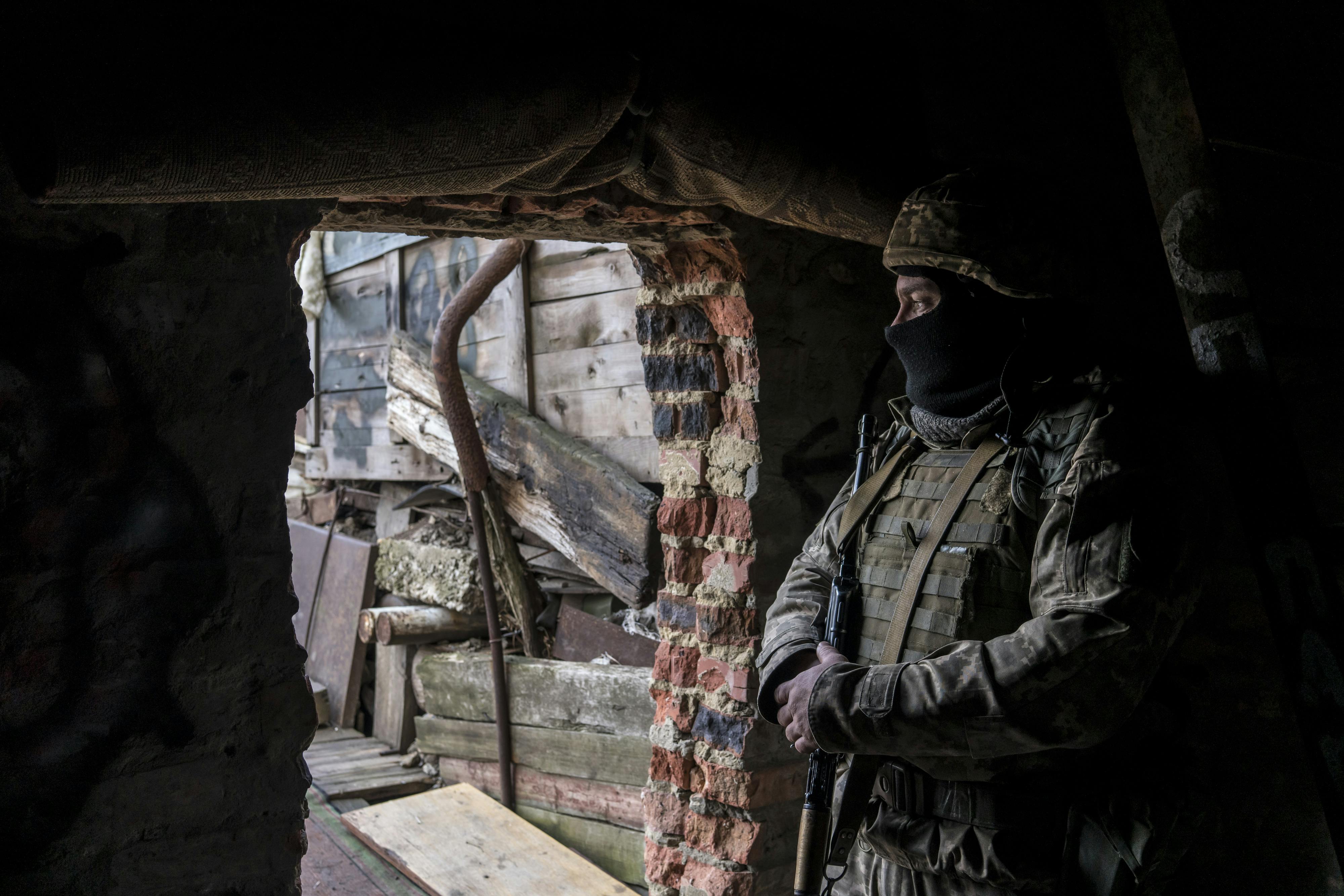 a Ukrainian soldier in a front-line position