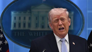 Donald Trump speaks vehemently with open mouth at press briefing