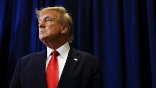 Donald Trump speaks to reporters before his speech at the annual Conservative Political Action Conference.