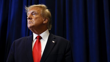 Donald Trump speaks to reporters before his speech at the annual Conservative Political Action Conference.