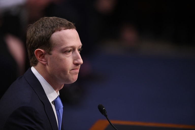 Mark Zuckerberg purses his lips while testifying in Congress