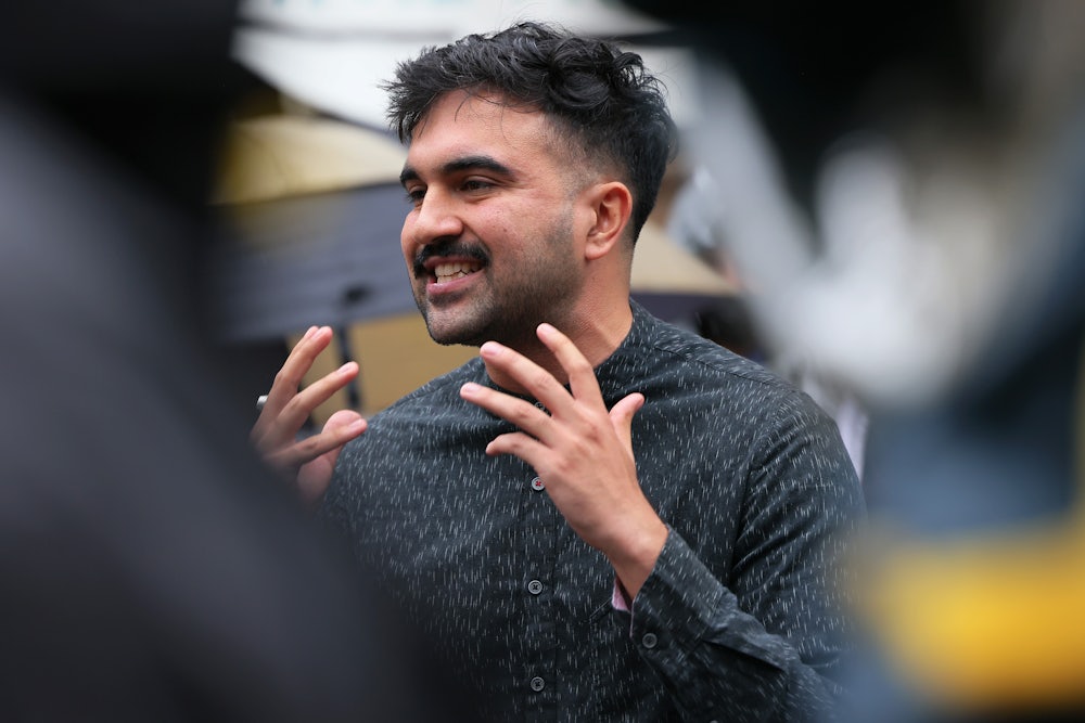Zohran Mamdani gestures while speaking.