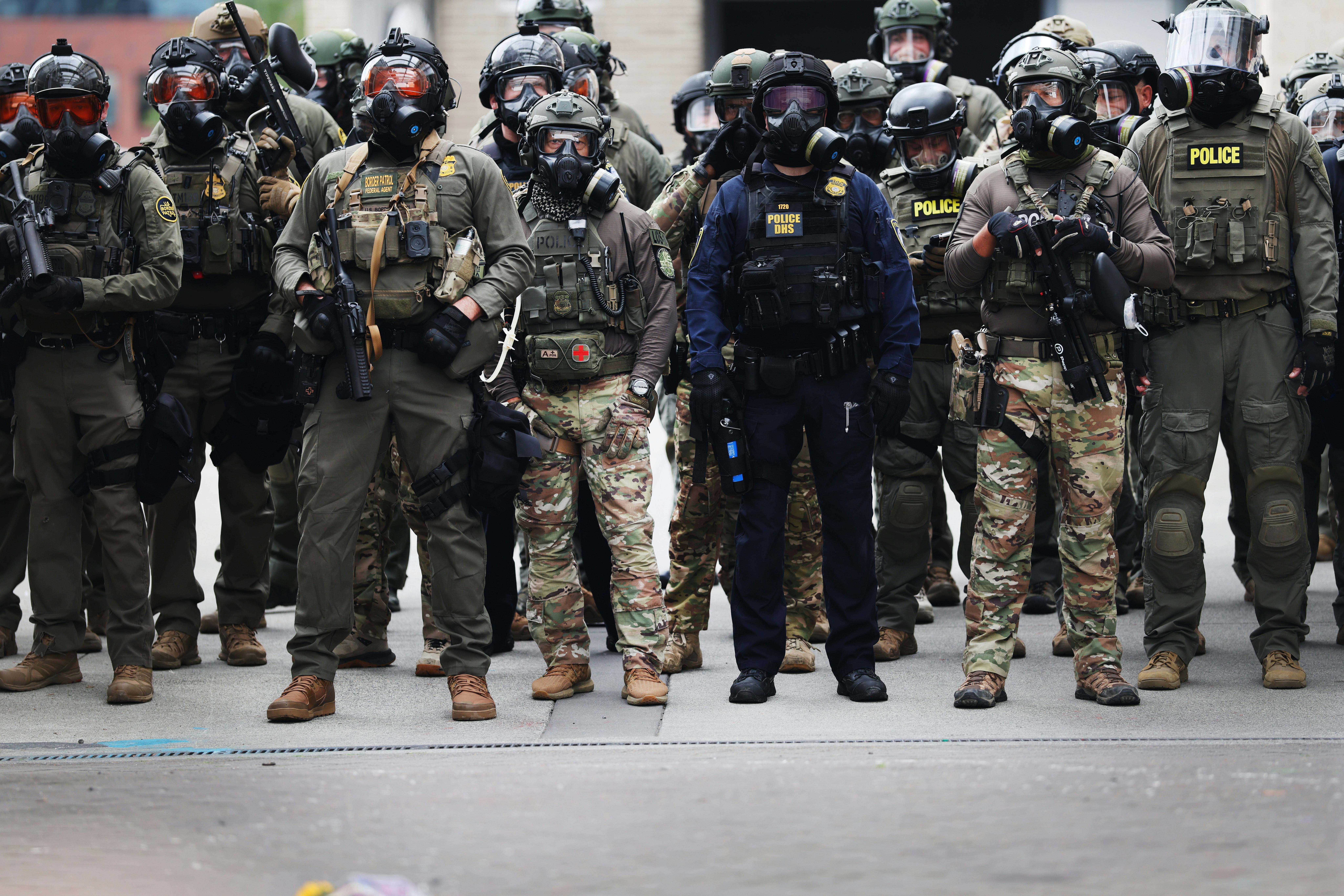 Federal agents clash with protesters outside a downtown U.S. Immigration and Customs Enforcement (ICE) facility in Portland, Oregon.