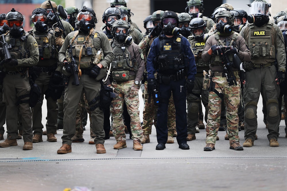 Federal agents clash with protesters outside a downtown U.S. Immigration and Customs Enforcement (ICE) facility in Portland, Oregon.