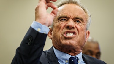 Robert F. Kennedy Jr. holds up his arm and gnashes his teeth. He's very angry