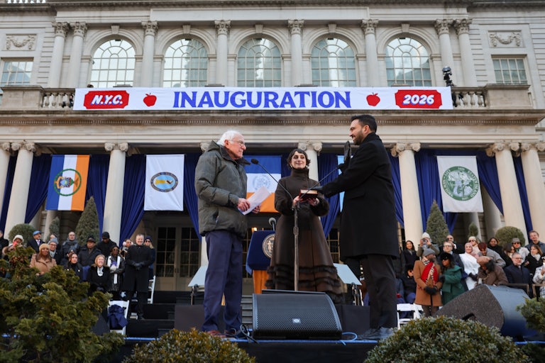 New York City Mayor Zohran Mamdani stands next to his wife Rama Duwaji as Vermont Senator Bernie Sanders swears him in