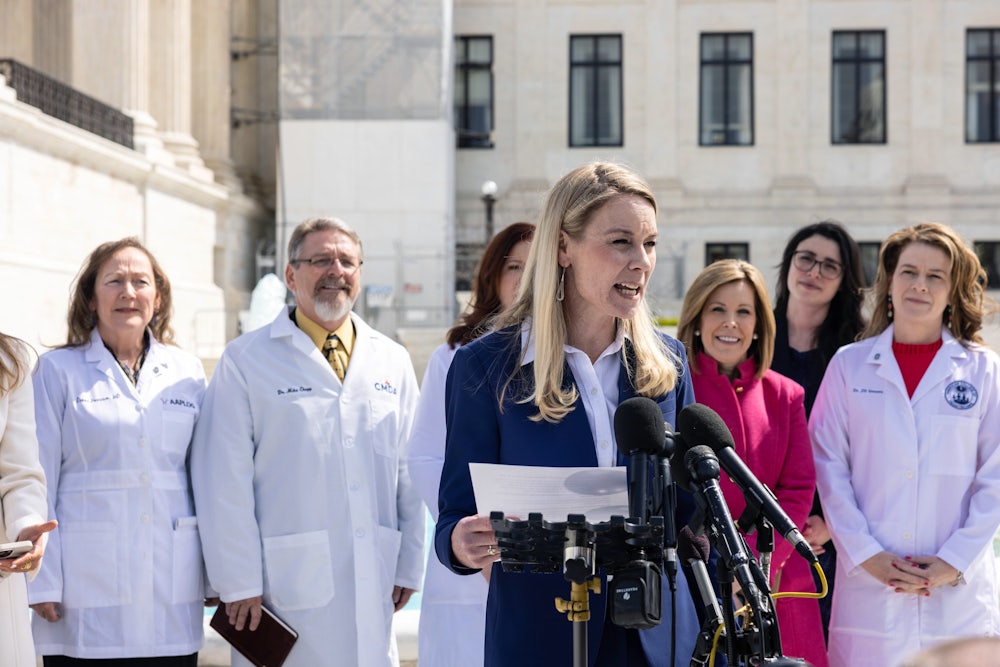 Erin Hawley speaks to the media as she departs the Supreme Court.