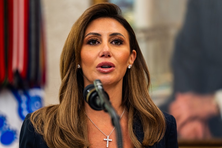 Alina Habba speaks at a podium in the Oval Office