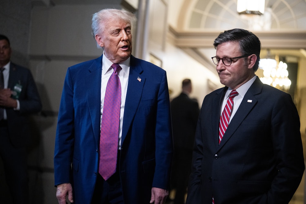 President Donald Trump and Speaker of the House Mike Johnson talk with reporters after a House Republican Conference meeting on the budget reconciliation bill in the U.S. Capitol.