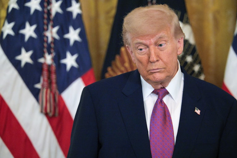 Donald Trump looks down