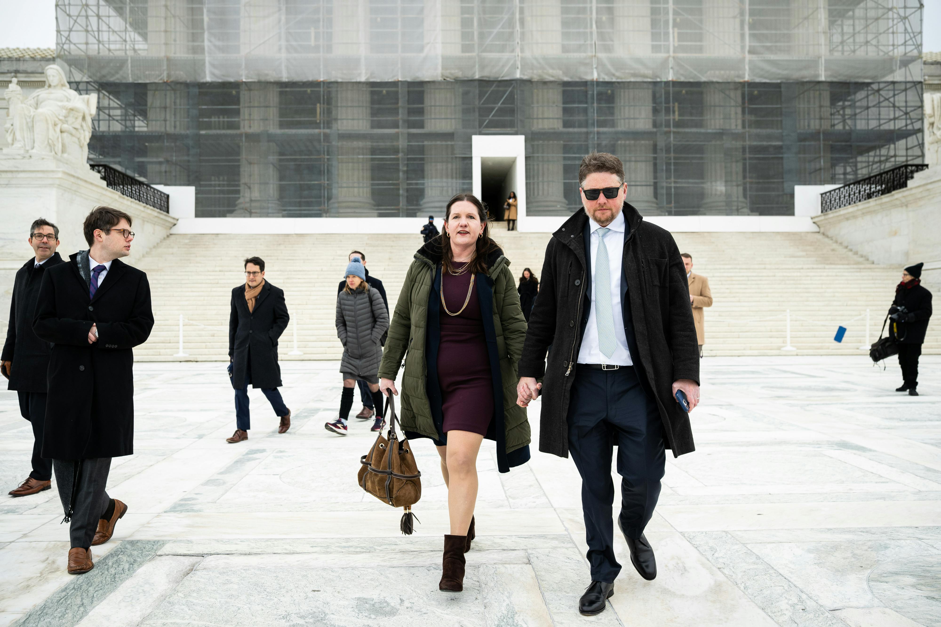 Rebecca Slaughter, former commissioner at the Federal Trade Commission, and her husband Justin Slaughter depart the U.S. Supreme Court in Washington, D.C. The court signaled it’s poised to give the president control over potentially dozens of traditionally independent federal agencies as the conservative wing cast doubt on a 90-year-old precedent.