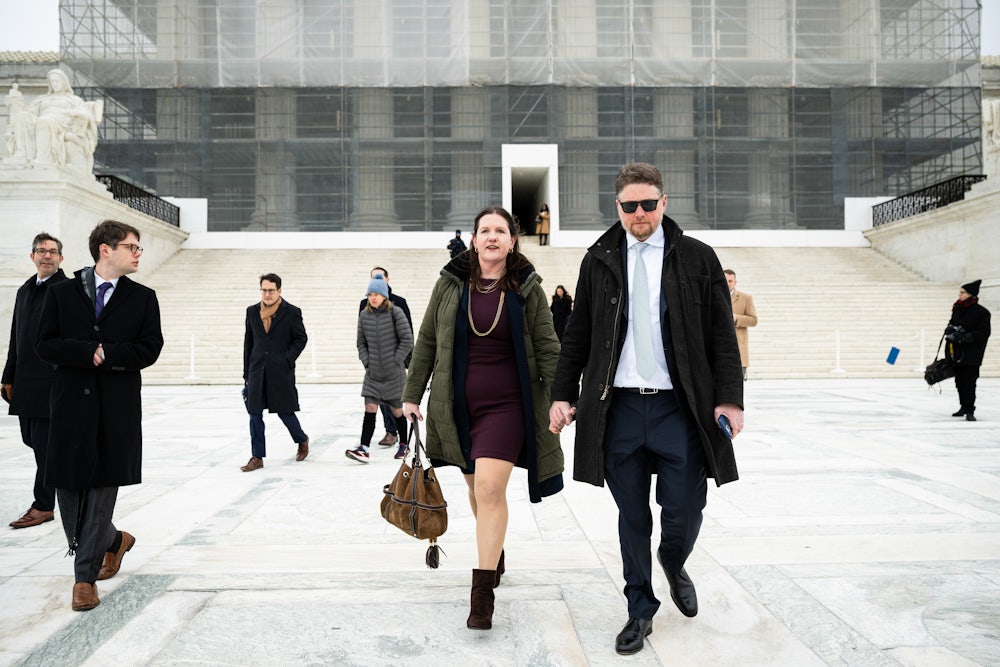 Rebecca Slaughter, former commissioner at the Federal Trade Commission, and her husband Justin Slaughter depart the U.S. Supreme Court in Washington, D.C. The court signaled it’s poised to give the president control over potentially dozens of traditionally independent federal agencies as the conservative wing cast doubt on a 90-year-old precedent.