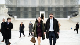 Rebecca Slaughter, former commissioner at the Federal Trade Commission, and her husband Justin Slaughter depart the U.S. Supreme Court in Washington, D.C. The court signaled it’s poised to give the president control over potentially dozens of traditionally independent federal agencies as the conservative wing cast doubt on a 90-year-old precedent.