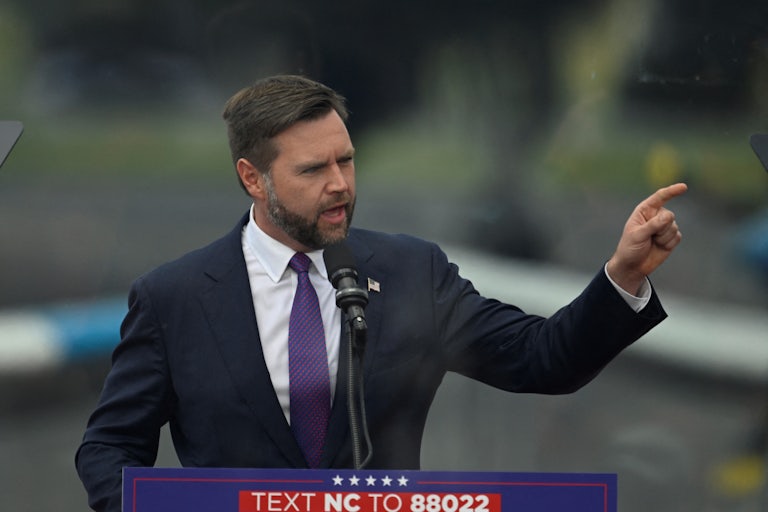 J.D. Vance gestures while speaking at a Donald Trump campaign event